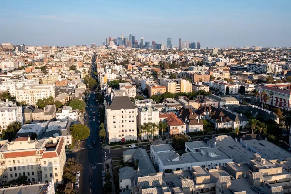 Aerial view of residential buildings in Koreatown, Los Angeles with downtown skyline in background